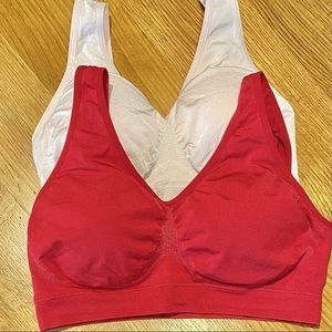 2 Wacoal Medium pull-on sports bras with no wires and removable pads.